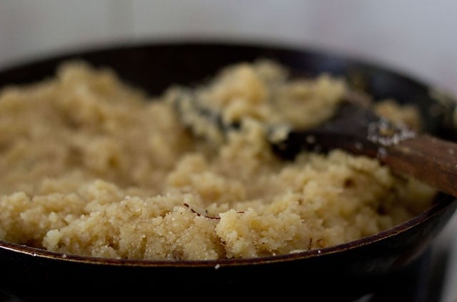 cooking banana sheera in pan.