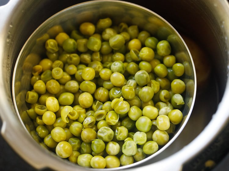 cooked peas and potatoes in pressure cooker