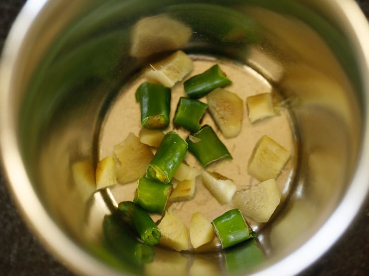 green chilli and ginger in a mortar pestle