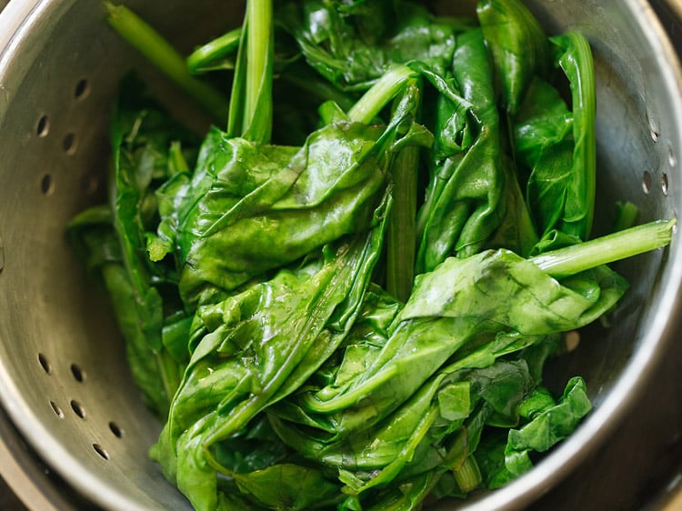 spinach in a colander