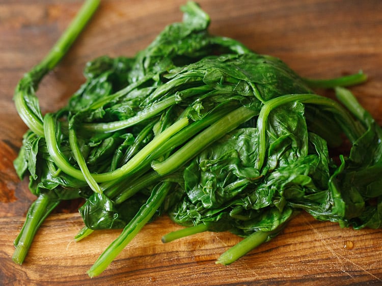 spinach on a chopping board