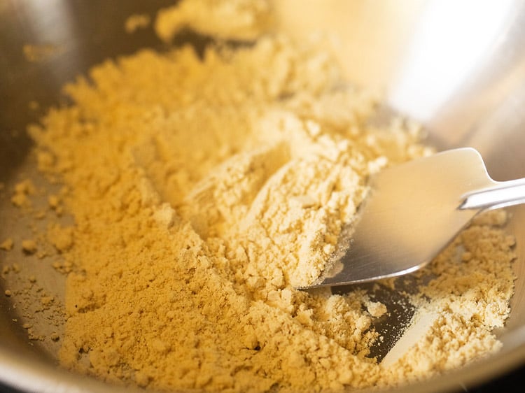 roasting gram flour in a pan