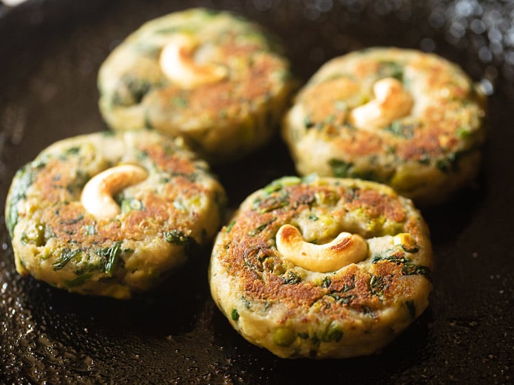 frying hara bhara kabab in a skillet