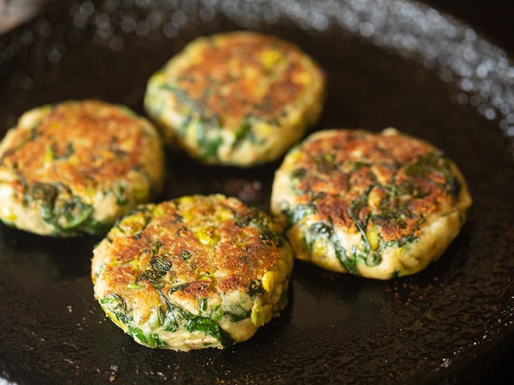 frying hara bhara kabab in a skillet