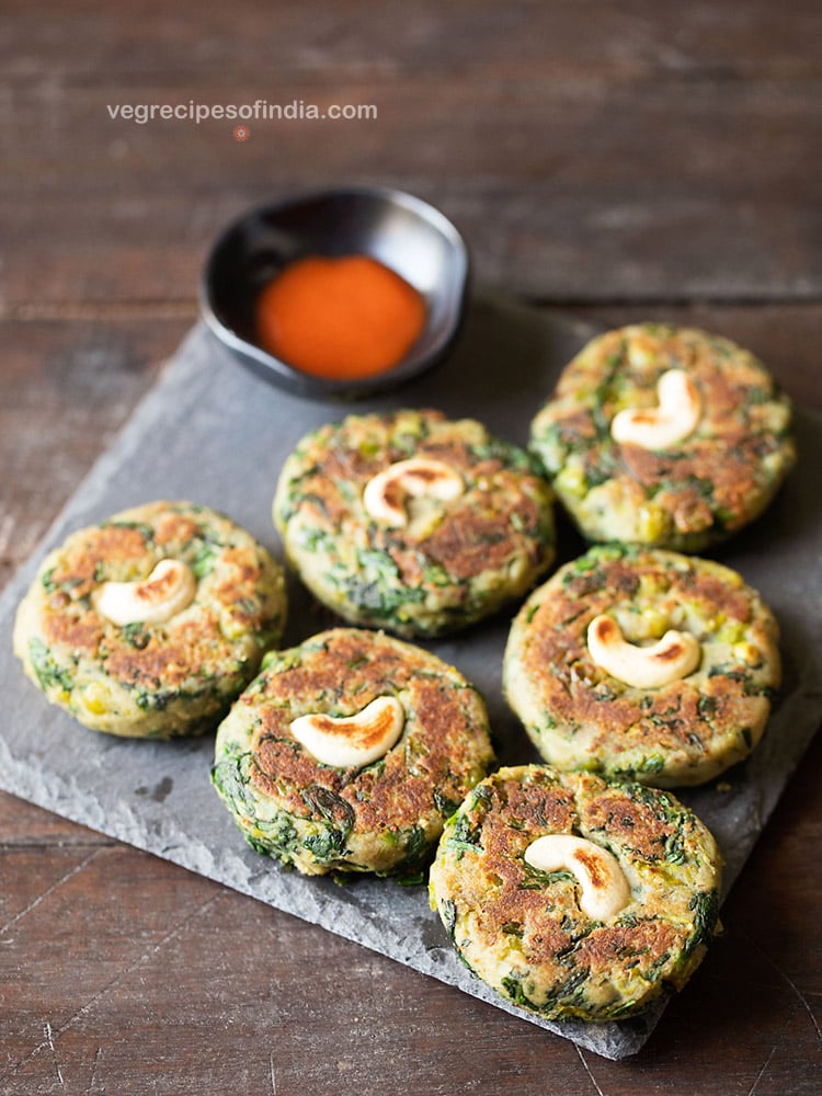 hara bhara kebab served with sauce on a board