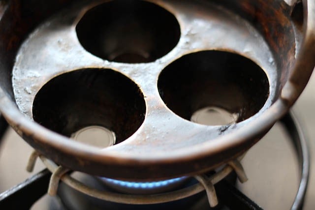 oil added to paniyaram pan kept on stovetop flame