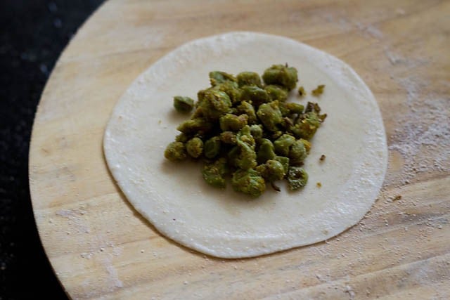 peas filling added to rolled dough