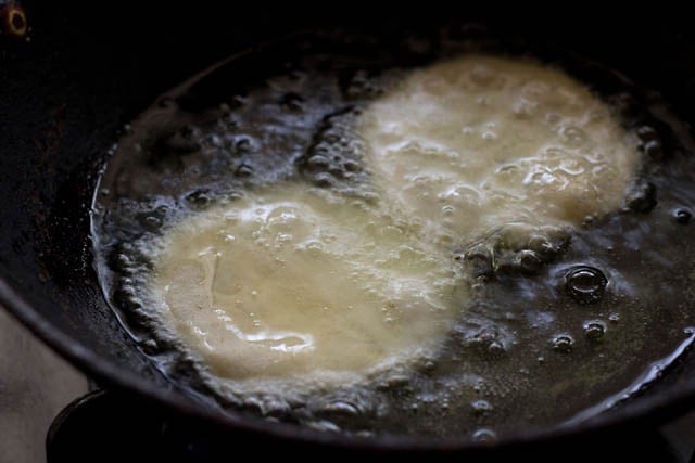 kachori placed in hot oil in kadai