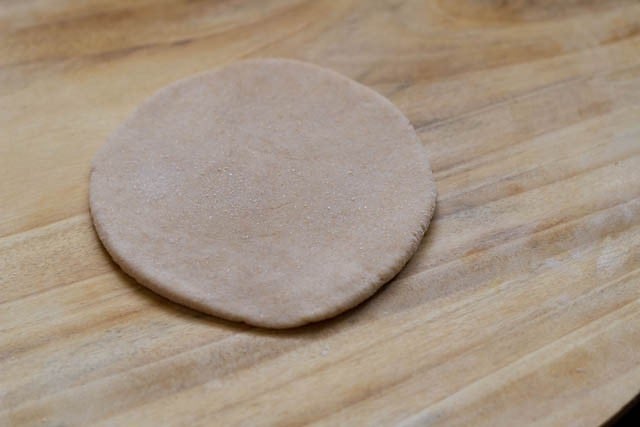 rolled dough on a wooden rolling board