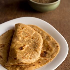 ajwain paratha served on a white plate