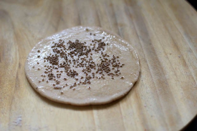 rolled paratha with ajwain and oil applied to it