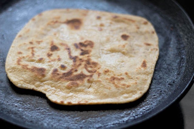 well roasted ajwain paratha on tawa