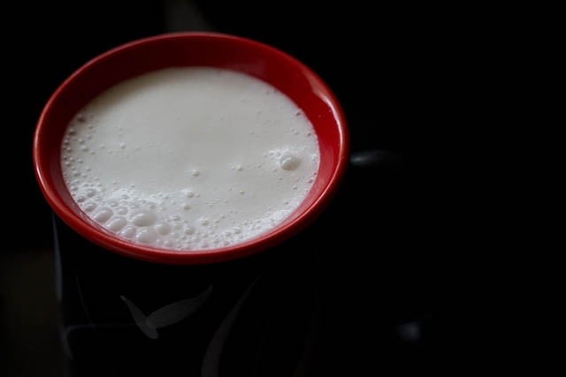 almond milk served in a ceramic mug.