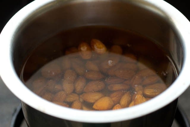 soaking almonds in hot water to make almond milk