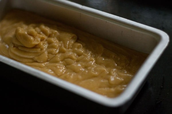 orange cake batter in baking tin