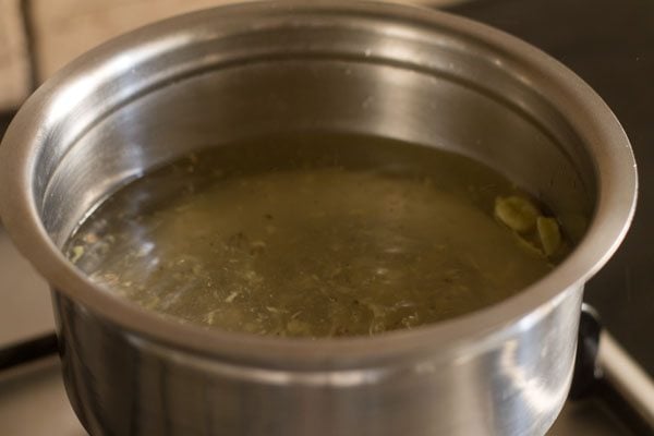 boiling water with ginger in a sauce pan