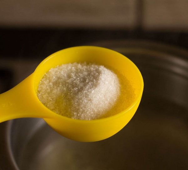 adding sugar to pan