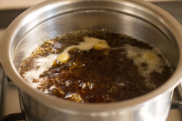 tea leaves steeping in ginger tea mixture