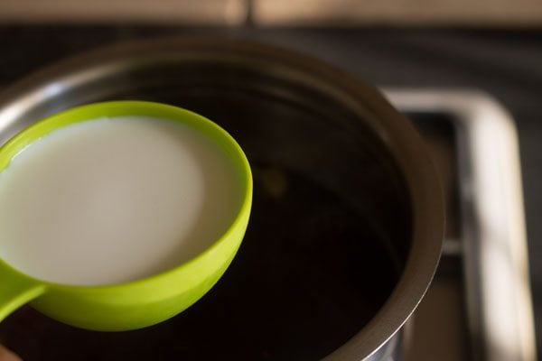 adding milk for making ginger tea recipe