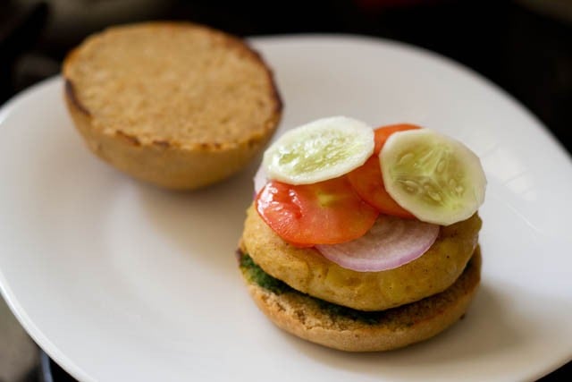 top with the sliced onions, tomatoes and cucumber.