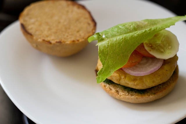 place lettuce atop the burger.