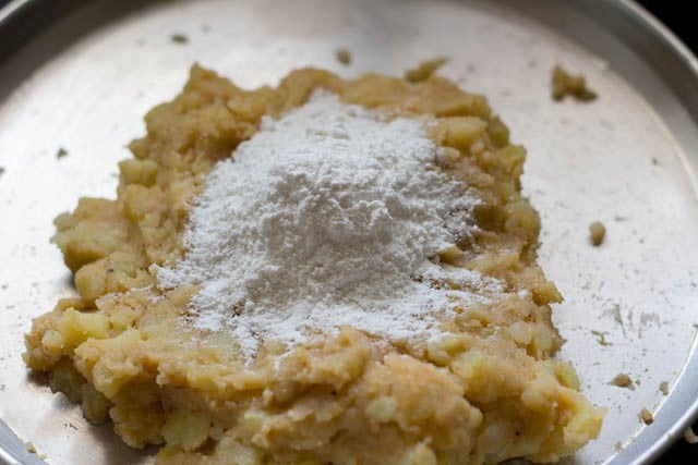 add rice flour or corn starch to potato mix.