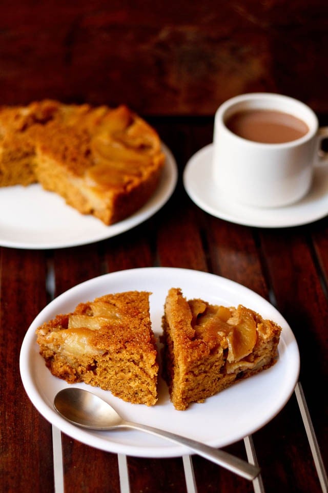 apple upside down cake served on a plate with tea