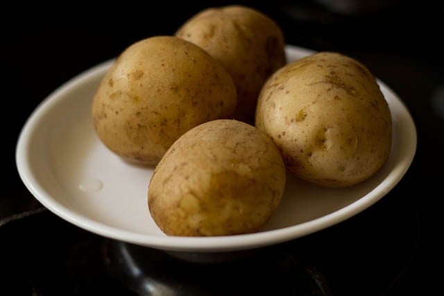 boiled potatoes on a white plate.