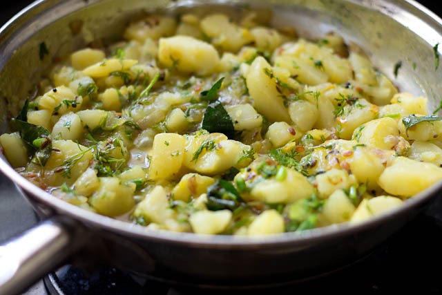 Add ¾ cup water to bhaji pan.