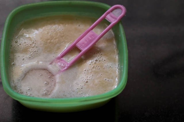 mixing sugar and yeast in water to activate the mixture