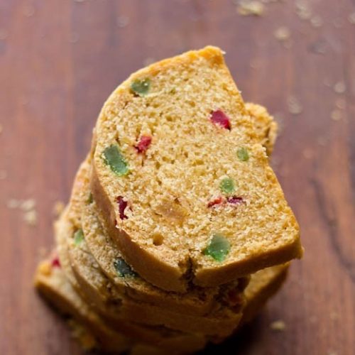 fruit bread slices on wooden board.