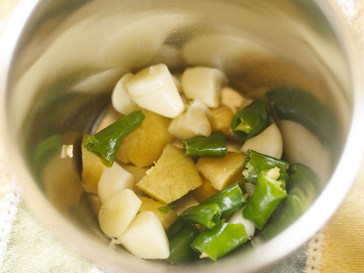 chopped ginger, garlic and green chillies in mortar-pestle