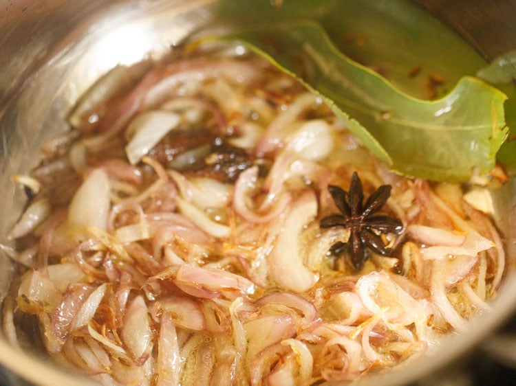 onions getting sautéed and starting to turn golden.