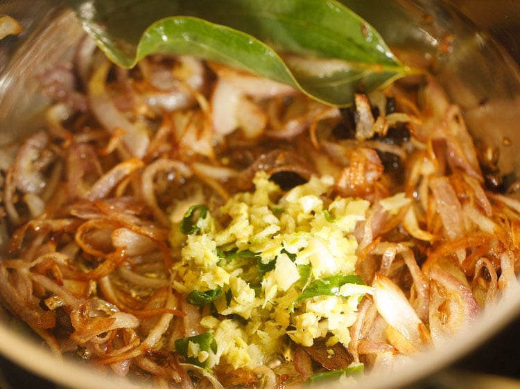 adding crushed ginger, garlic and green chilli paste to the fried onions