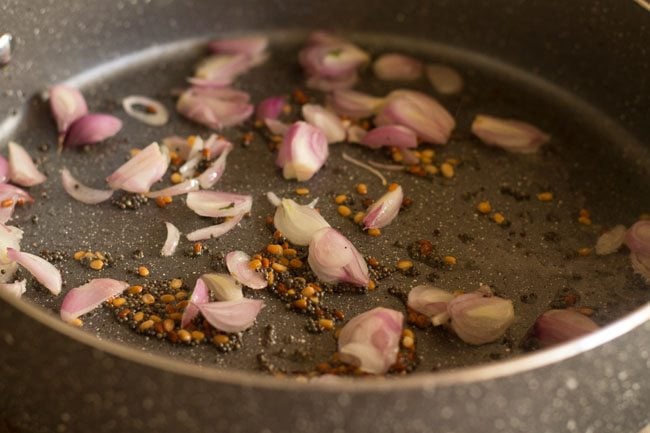 adding shallots and frying them