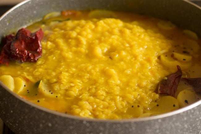 adding lentils to the pan