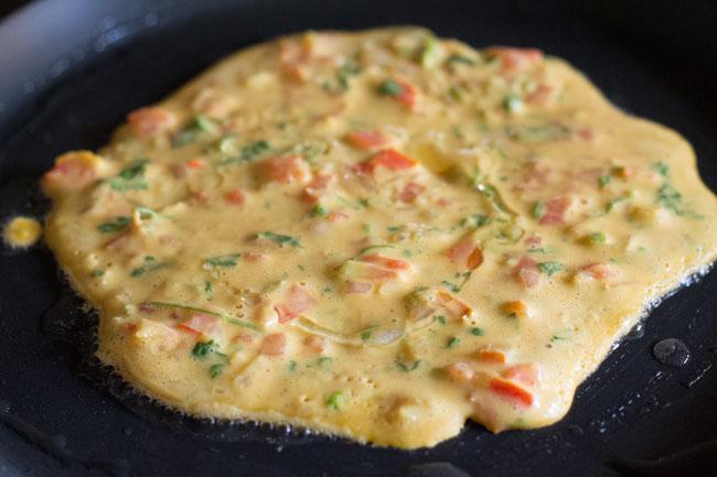 cooking vegan omelette on skillet
