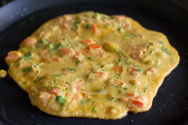 tomato omelette being cooked