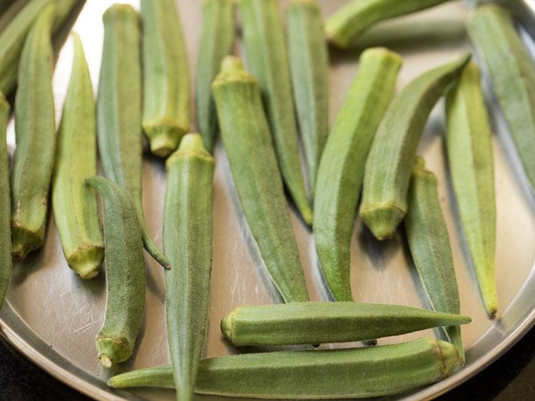 bhindi on a steel plate for making bhindi masala recipe