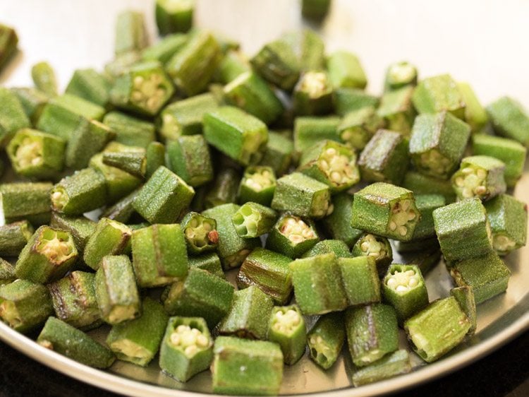 sautéed bhindi placed on a plate for making bhindi masala recipe. 