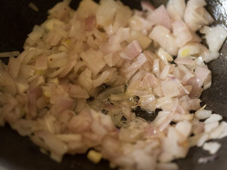 sautéing onions for making bhindi masala recipe. 