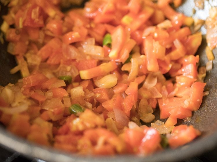 tomatoes being sautéed