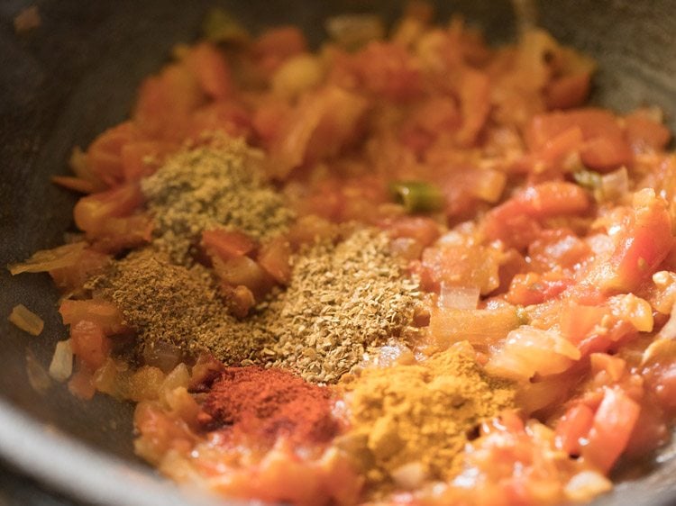 fennel powder, coriander powder and dried mango powder added to tomatoes. 