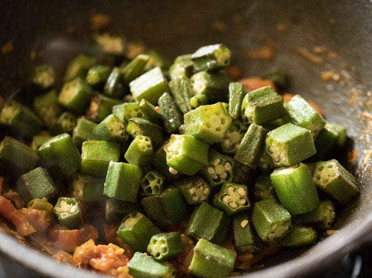 sautéed okra added to the pan. 