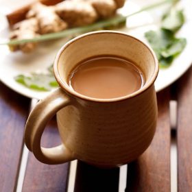 herbal tea in a cup and herbs and spices for herbal tea