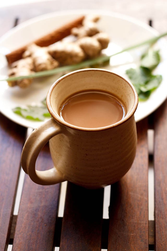 herbal tea in a cup and herbs and spices for herbal tea