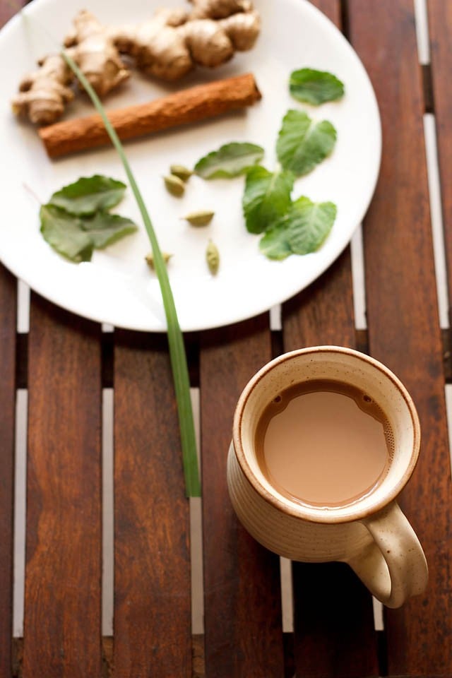 herbal tea served in a cup and spices, herbs on a plate for herbal tea