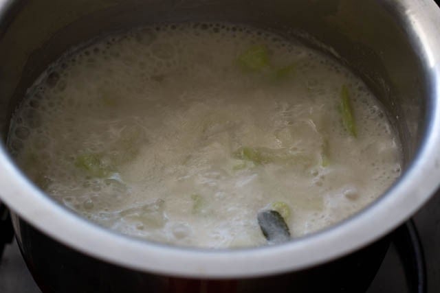 cooking lauki curry in the pan