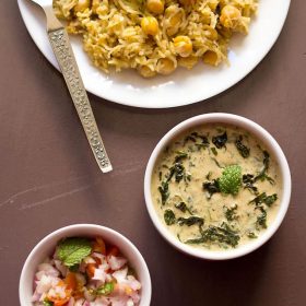 palak raita served alongside with chana pulao and kachumber.