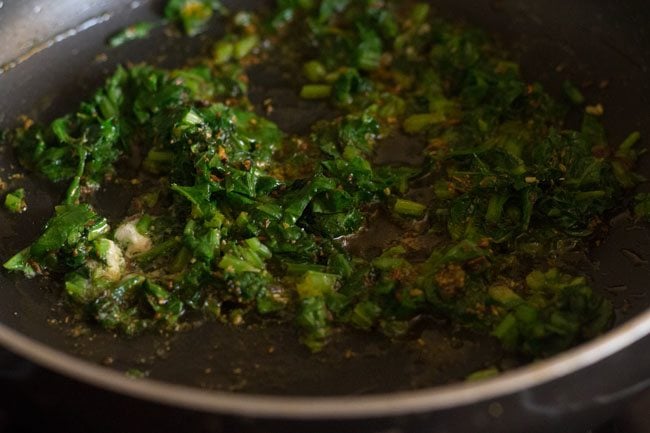 sautéing spinach for palak raita. 